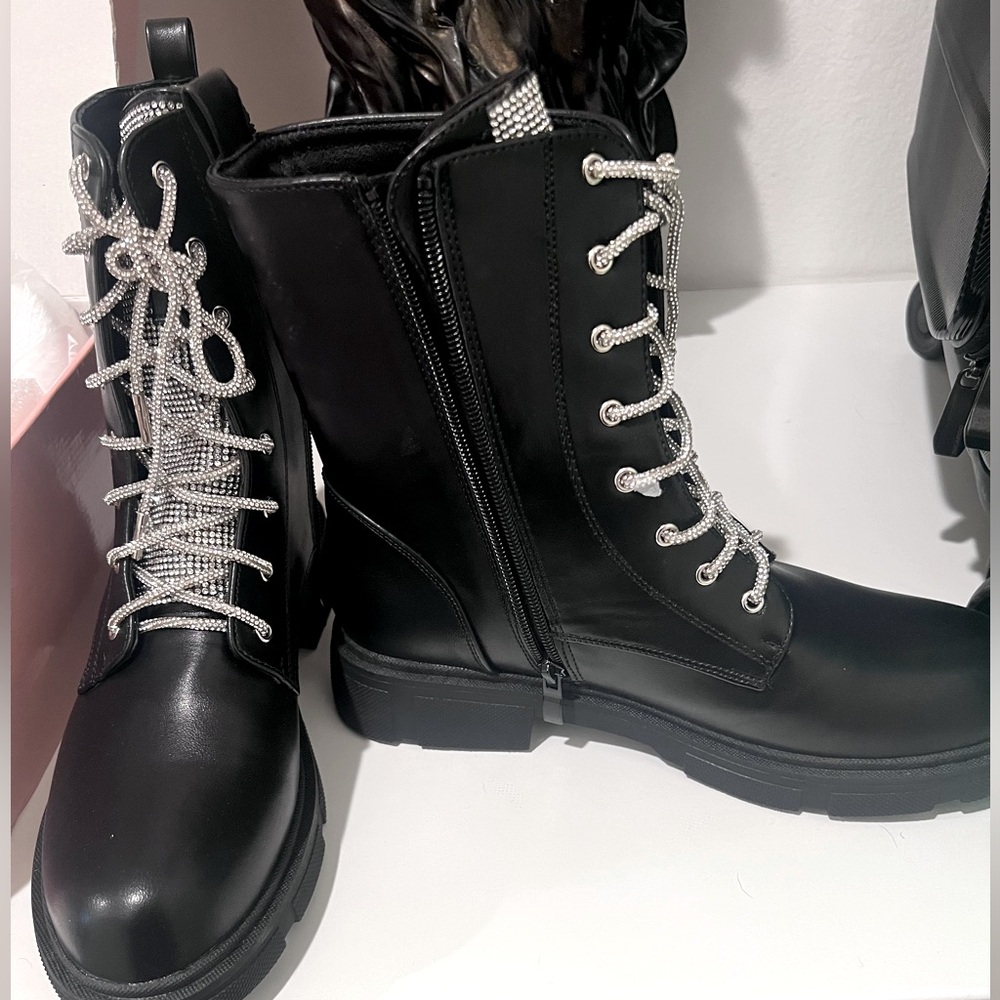 Rhinestone encrusted lace combat boots.